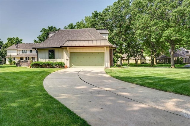 8311 Wenonga Rd, Leawood, KS 66206 - view of front of home with board and batten siding, a garage, a front lawn, and driveway