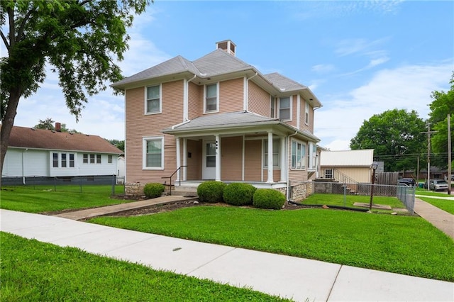 800 Brown Ave, Osawatomie, KS 66064 - victorian-style house featuring covered porch and a chimney
