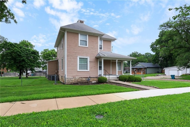 800 Brown Ave, Osawatomie, KS 66064 - view of front of property featuring a porch, a front lawn, and a chimney