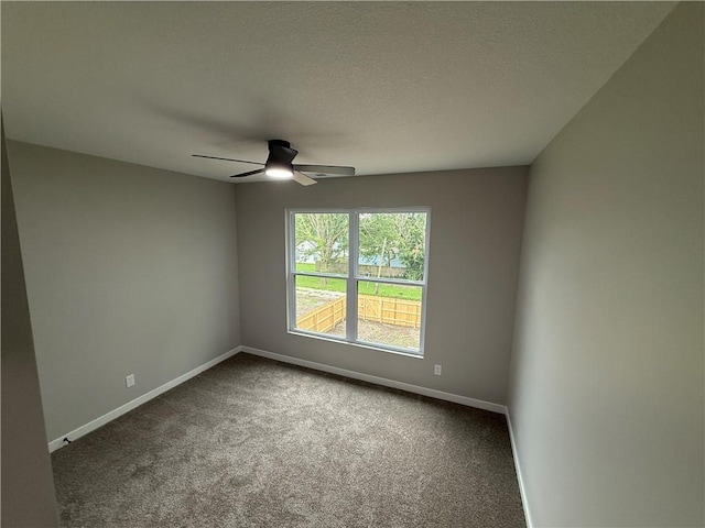1141 Walnut Ave, Osawatomie, KS 66064 - carpeted empty room featuring a ceiling fan and baseboards