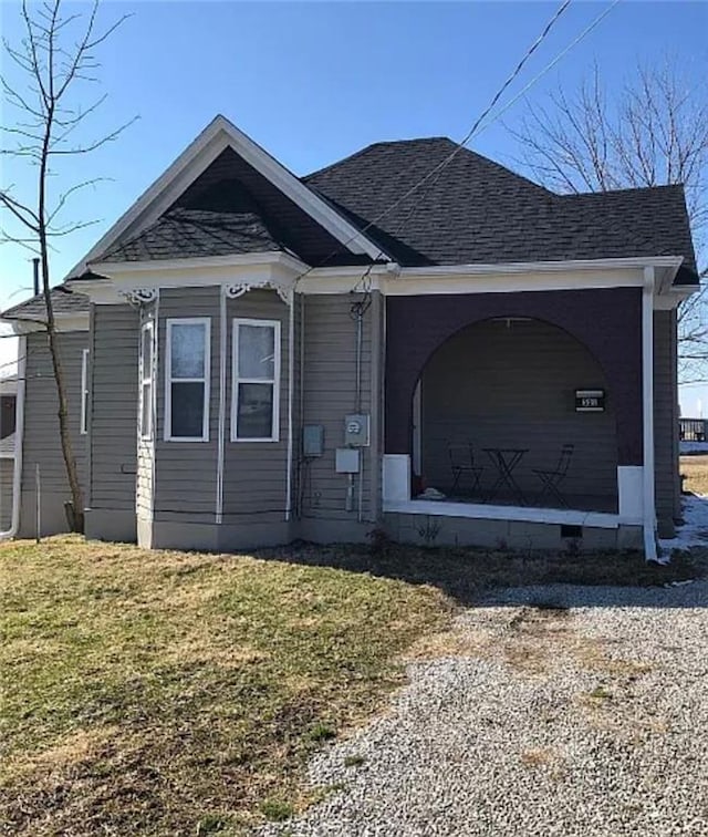 501 W Mcpherson St, Knob Noster, MO 65336 - view of front of property with a front lawn and a shingled roof