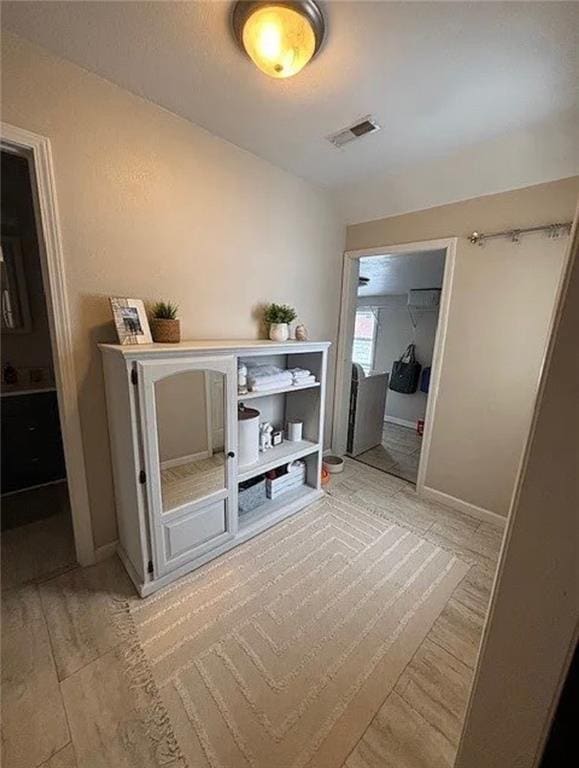 501 W Mcpherson St, Knob Noster, MO 65336 - corridor with light wood-type flooring and baseboards