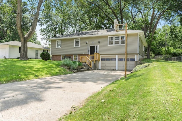 4820 Stearns Ln, Shawnee, KS 66203 - bi-level home featuring an attached garage and driveway