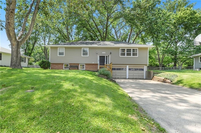4820 Stearns Ln, Shawnee, KS 66203 - raised ranch featuring an attached garage and driveway