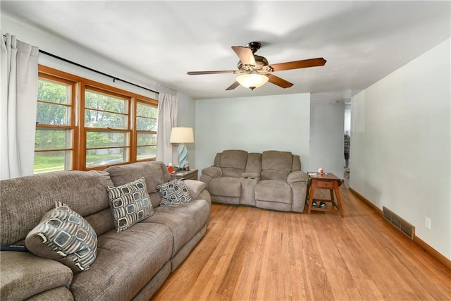 4820 Stearns Ln, Shawnee, KS 66203 - living room with light wood finished floors and a ceiling fan