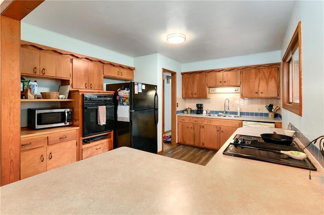 4820 Stearns Ln, Shawnee, KS 66203 - kitchen featuring black appliances, decorative backsplash, light countertops, wood finished floors, and open shelves