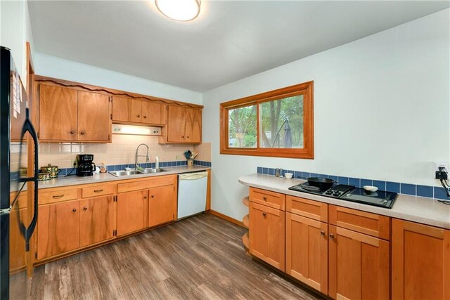 4820 Stearns Ln, Shawnee, KS 66203 - kitchen featuring black appliances, dark wood-type flooring, backsplash, and light countertops