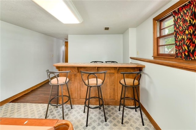 4820 Stearns Ln, Shawnee, KS 66203 - indoor wet bar featuring baseboards