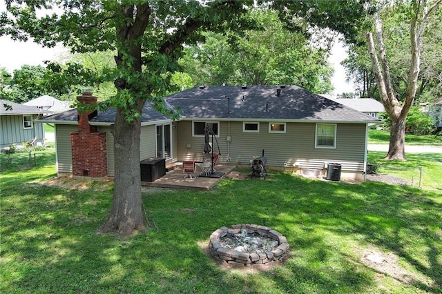 4820 Stearns Ln, Shawnee, KS 66203 - back of house featuring an outdoor fire pit, a patio area, and roof with shingles