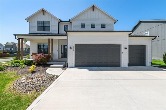 1505 SW Georgetown Dr, Lees Summit, MO 64082 - modern farmhouse style home with board and batten siding, concrete driveway, covered porch, and an attached garage