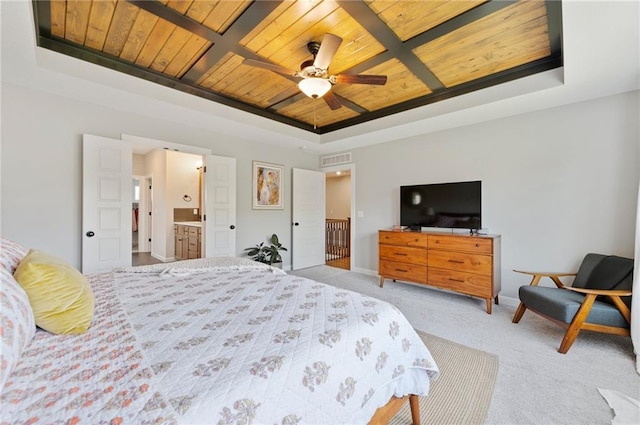 1505 SW Georgetown Dr, Lees Summit, MO 64082 - bedroom with wooden ceiling, a tray ceiling, carpet, baseboards, and ensuite bath