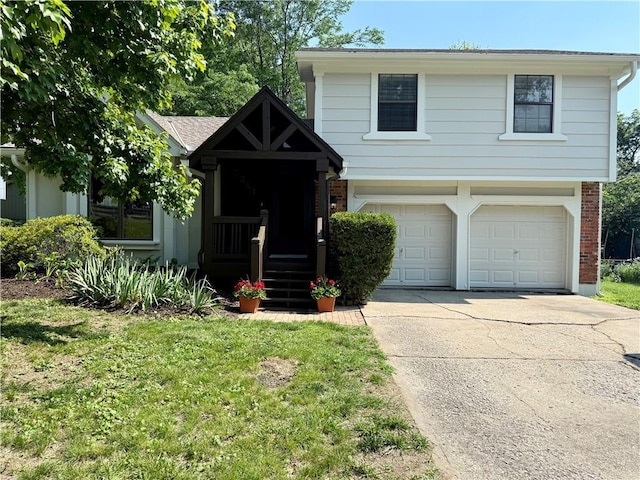 5341 Locust Ln, Kansas City, KS 66106 - view of front facade with brick siding, concrete driveway, a garage, and a front lawn
