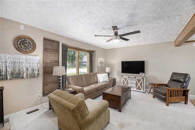5341 Locust Ln, Kansas City, KS 66106 - living area featuring a ceiling fan, light carpet, and a textured ceiling