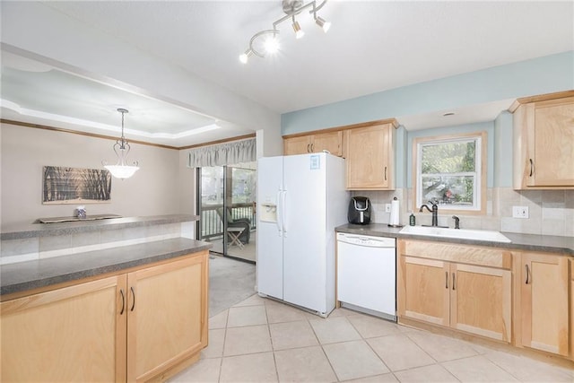 5341 Locust Ln, Kansas City, KS 66106 - kitchen with white appliances, light brown cabinets, dark countertops, decorative backsplash, and a raised ceiling