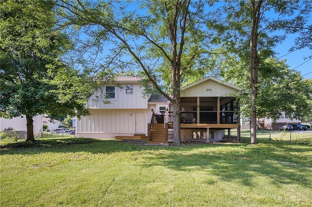 5341 Locust Ln, Kansas City, KS 66106 - rear view of property with a sunroom and stairs