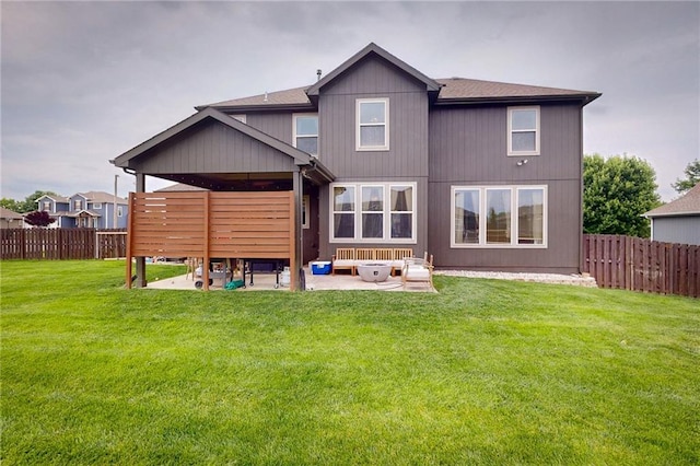 3201 SE 3rd St, Lees Summit, MO 64063 - rear view of property featuring a patio, a fenced backyard, and roof with shingles