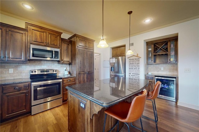 3201 SE 3rd St, Lees Summit, MO 64063 - kitchen with stainless steel appliances, beverage cooler, dark wood-style flooring, ornamental molding, and tasteful backsplash