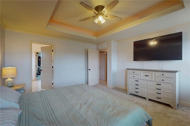 3201 SE 3rd St, Lees Summit, MO 64063 - bedroom featuring a tray ceiling, crown molding, light carpet, and ceiling fan