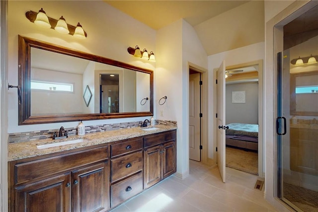 3201 SE 3rd St, Lees Summit, MO 64063 - full bathroom with double vanity, a stall shower, ensuite bath, and lofted ceiling