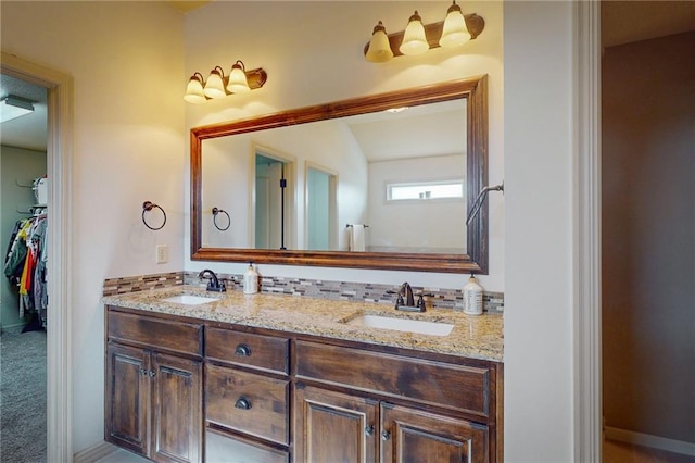 3201 SE 3rd St, Lees Summit, MO 64063 - bathroom featuring double vanity and a spacious closet