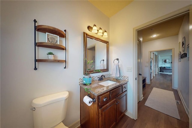 3201 SE 3rd St, Lees Summit, MO 64063 - bathroom featuring vanity and wood finished floors