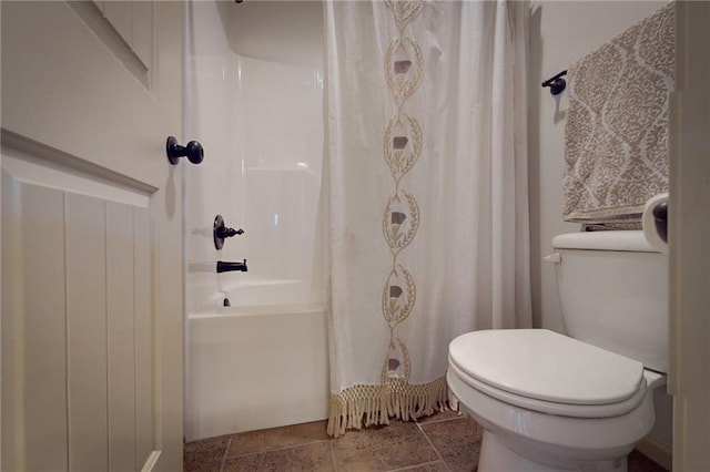 3201 SE 3rd St, Lees Summit, MO 64063 - bathroom with shower / tub combo with curtain and stone finish flooring