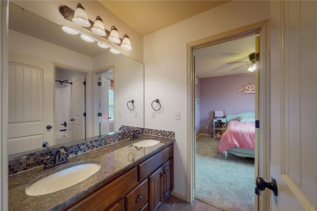 3201 SE 3rd St, Lees Summit, MO 64063 - full bath featuring ensuite bathroom, double vanity, a ceiling fan, and tile patterned flooring
