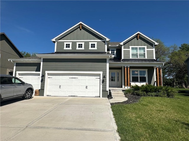 3117 SW Arbor Tree Dr, Lees Summit, MO 64082 - view of front of home featuring board and batten siding, a front lawn, concrete driveway, and metal roof