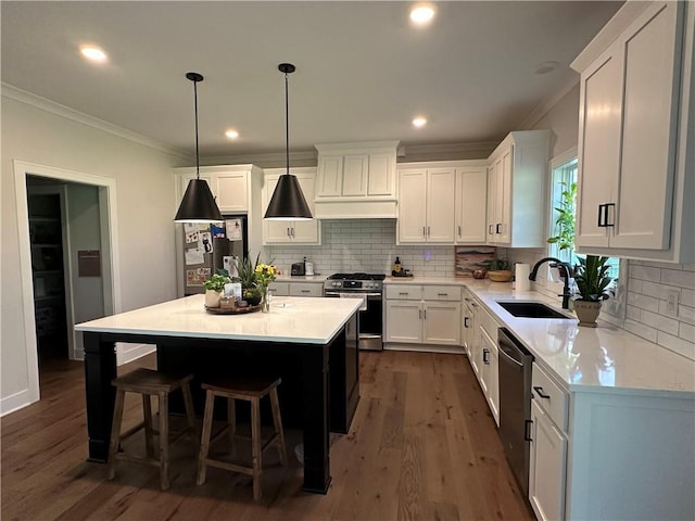 3117 SW Arbor Tree Dr, Lees Summit, MO 64082 - kitchen featuring a sink, appliances with stainless steel finishes, crown molding, dark wood-style flooring, and white cabinets