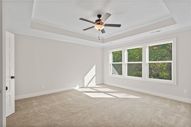 3117 SW Arbor Tree Dr, Lees Summit, MO 64082 - carpeted spare room with a raised ceiling, baseboards, ceiling fan, and crown molding