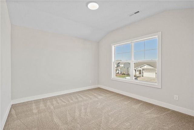 3117 SW Arbor Tree Dr, Lees Summit, MO 64082 - carpeted empty room with vaulted ceiling and baseboards