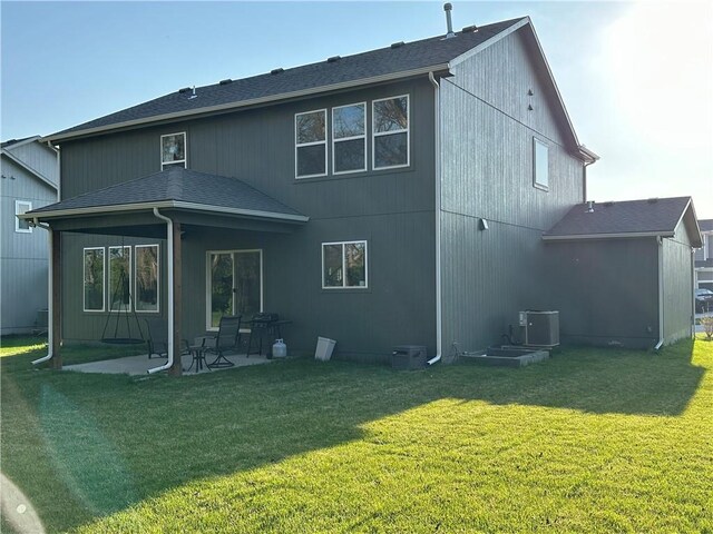 3117 SW Arbor Tree Dr, Lees Summit, MO 64082 - rear view of house featuring a patio area, a yard, central AC, and a shingled roof