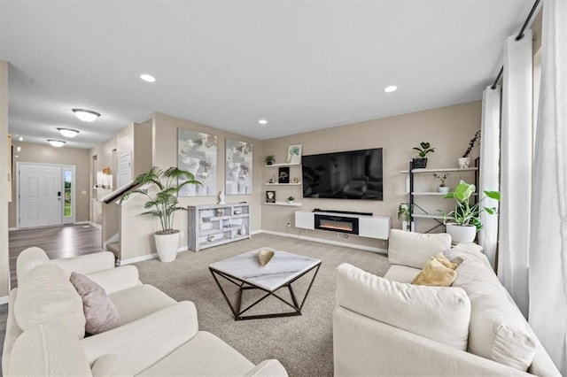 1420 SW Cornwall Rd, Lees Summit, MO 64083 - carpeted living room with recessed lighting, a glass covered fireplace, and built in features