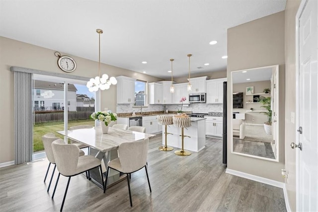 1420 SW Cornwall Rd, Lees Summit, MO 64083 - dining area featuring light wood-style floors and recessed lighting