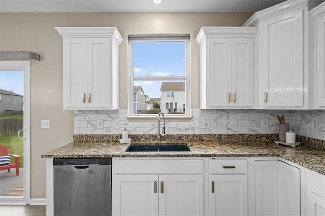 1420 SW Cornwall Rd, Lees Summit, MO 64083 - kitchen with stainless steel dishwasher, white cabinets, and backsplash
