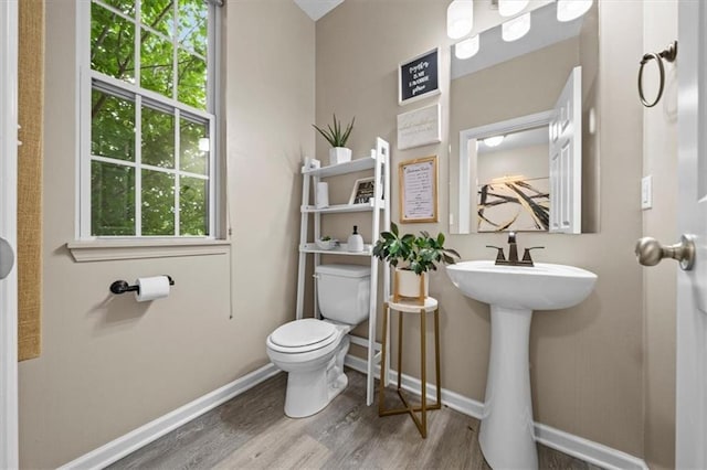 1420 SW Cornwall Rd, Lees Summit, MO 64083 - half bath featuring toilet and wood finished floors