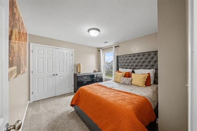 1420 SW Cornwall Rd, Lees Summit, MO 64083 - carpeted bedroom featuring a textured ceiling and a closet
