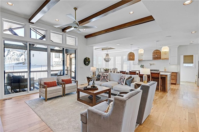 17029 King St, Overland Park, KS 66221 - living room with beamed ceiling, a ceiling fan, light wood-type flooring, recessed lighting, and baseboards
