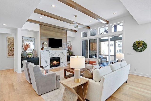 17029 King St, Overland Park, KS 66221 - living area with ceiling fan, a high end fireplace, light wood-style flooring, recessed lighting, and baseboards