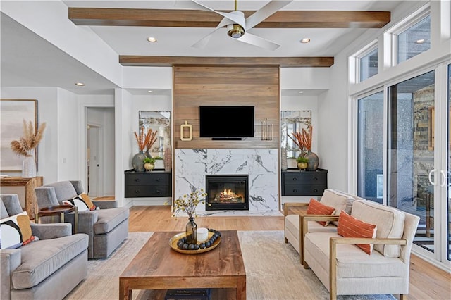17029 King St, Overland Park, KS 66221 - living area featuring beam ceiling, a fireplace, light wood-style floors, ceiling fan, and recessed lighting