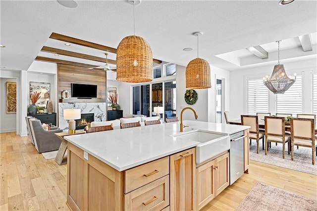 17029 King St, Overland Park, KS 66221 - kitchen featuring light brown cabinetry, a sink, stainless steel dishwasher, light wood-style floors, and recessed lighting