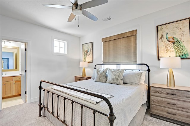 17029 King St, Overland Park, KS 66221 - bedroom with light carpet, ensuite bathroom, a sink, and ceiling fan