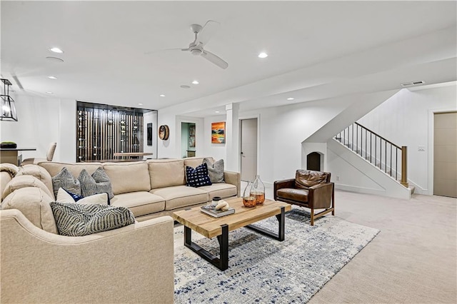 17029 King St, Overland Park, KS 66221 - living area featuring stairway, recessed lighting, light colored carpet, and ceiling fan