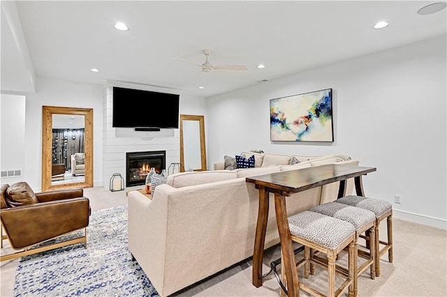 17029 King St, Overland Park, KS 66221 - living area featuring a ceiling fan, recessed lighting, a fireplace, light carpet, and baseboards