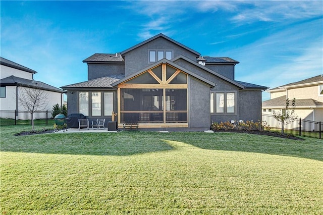 17029 King St, Overland Park, KS 66221 - rear view of house featuring stucco siding, a sunroom, and a patio