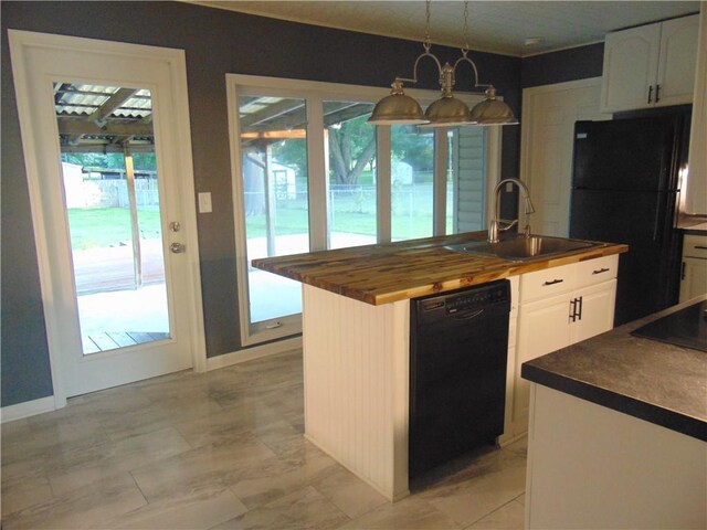 241 E S St, Peculiar, MO 64078 - kitchen with black appliances, wood counters, plenty of natural light, and white cabinets