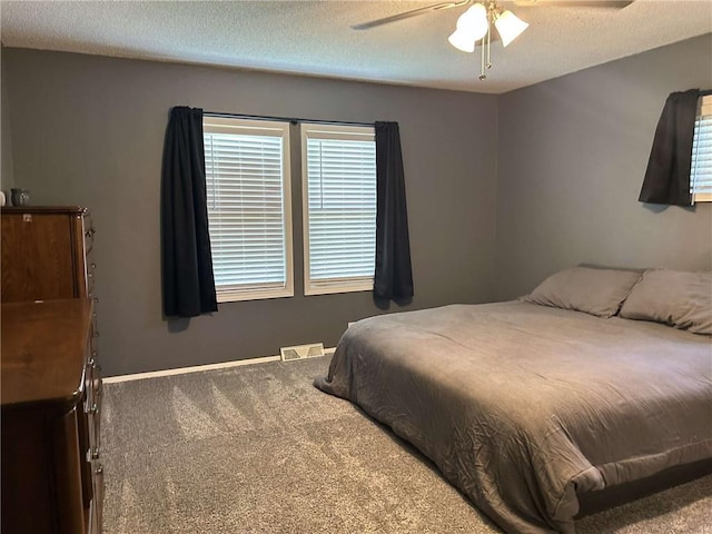 241 E S St, Peculiar, MO 64078 - carpeted bedroom with ceiling fan and a textured ceiling