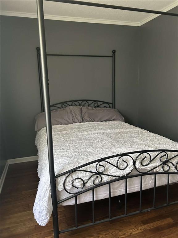 241 E S St, Peculiar, MO 64078 - bedroom with crown molding and wood finished floors
