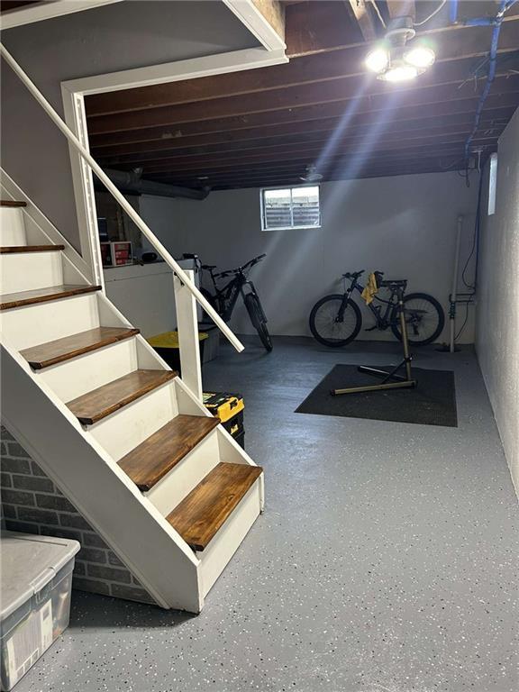 241 E S St, Peculiar, MO 64078 - basement featuring stairway