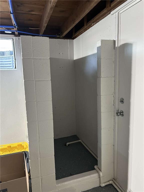 241 E S St, Peculiar, MO 64078 - below grade area featuring concrete block wall